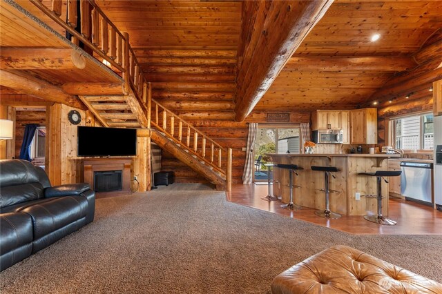 living area featuring wood ceiling, rustic walls, lofted ceiling, and wood finished floors