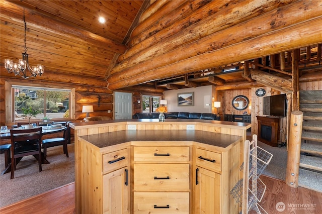 kitchen with dark countertops, a wealth of natural light, and open floor plan