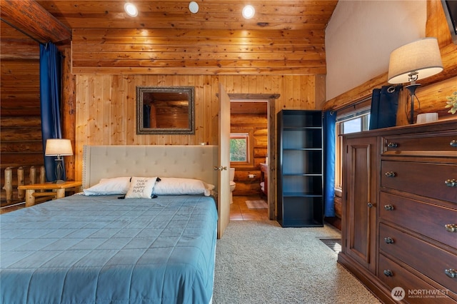 bedroom with lofted ceiling, wooden ceiling, wood walls, and light colored carpet