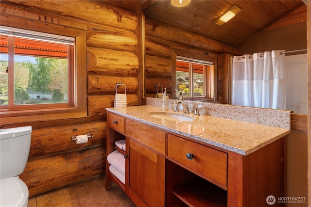 full bath with rustic walls, vaulted ceiling, toilet, vanity, and wooden ceiling