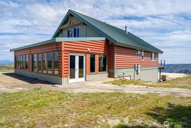 27 Scenic Dr, Brewster, WA 98812 - rear view of house with metal roof and french doors