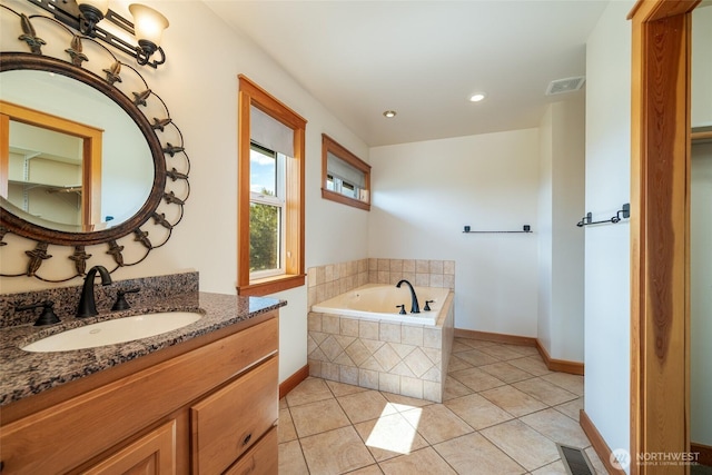 27 Scenic Dr, Brewster, WA 98812 - full bath with tile patterned floors, a garden tub, vanity, recessed lighting, and baseboards