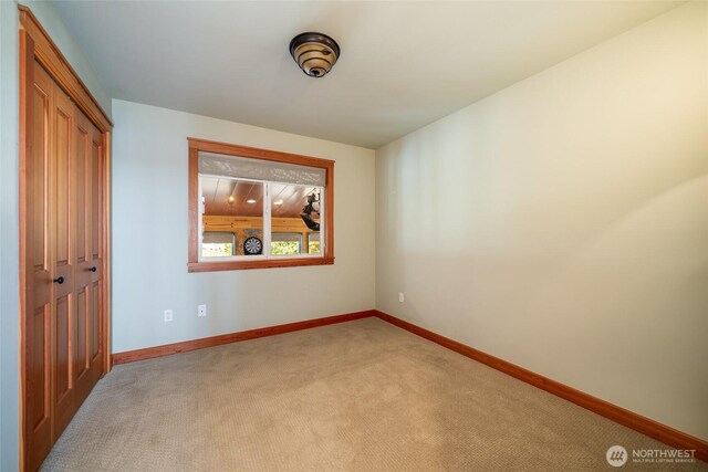 27 Scenic Dr, Brewster, WA 98812 - unfurnished bedroom featuring carpet flooring, a closet, and baseboards
