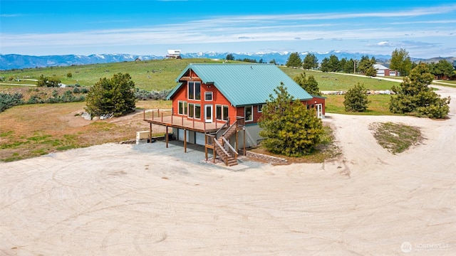 27 Scenic Dr, Brewster, WA 98812 - back of house featuring dirt driveway, a mountain view, a view of countryside, and metal roof