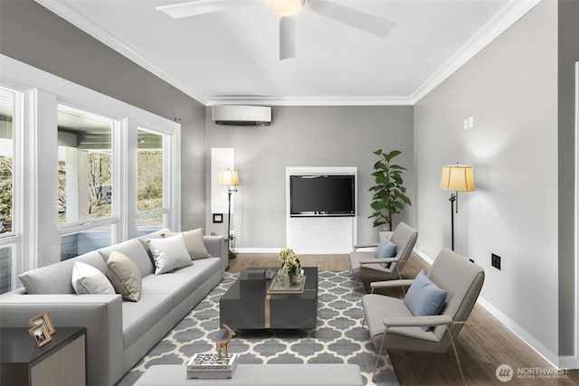 4723 Parker Rd E, Sumner, WA 98390 - living room featuring a ceiling fan, a wall mounted air conditioner, baseboards, crown molding, and wood finished floors