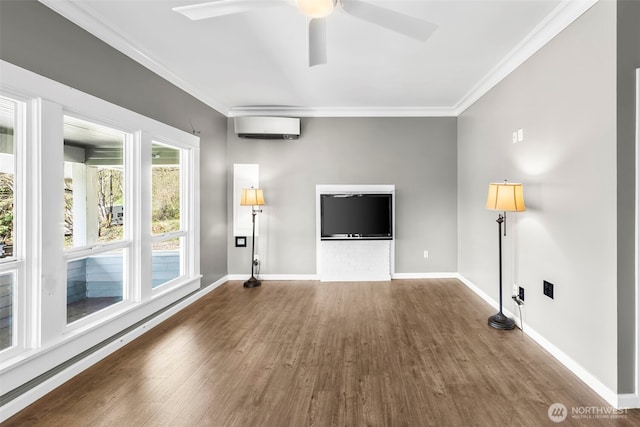 4723 Parker Rd E, Sumner, WA 98390 - unfurnished living room featuring crown molding, wood finished floors, baseboards, and a wall mounted AC