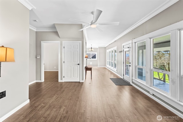 4723 Parker Rd E, Sumner, WA 98390 - unfurnished living room with a healthy amount of sunlight, wood finished floors, baseboards, and ornamental molding