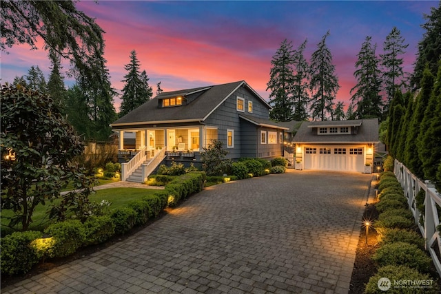 3119 108th Ave SE, Bellevue, WA 98004 - view of front of property featuring decorative driveway, covered porch, stairs, and a garage