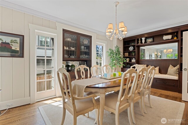 3119 108th Ave SE, Bellevue, WA 98004 - dining room with a chandelier, ornamental molding, and light wood-style flooring