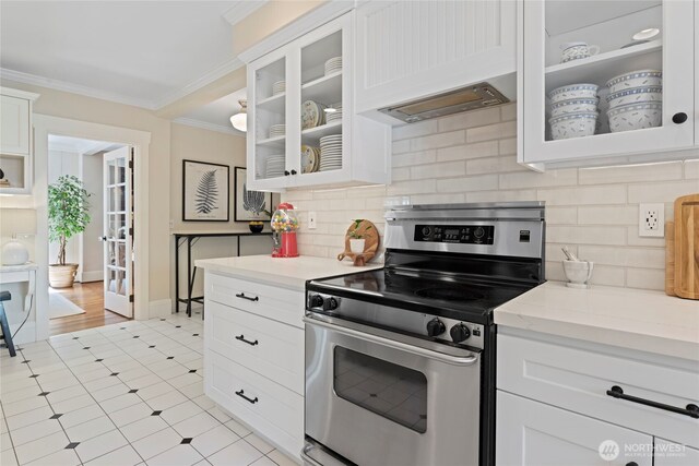 3119 108th Ave SE, Bellevue, WA 98004 - kitchen featuring stainless steel range with electric cooktop, crown molding, white cabinetry, and backsplash