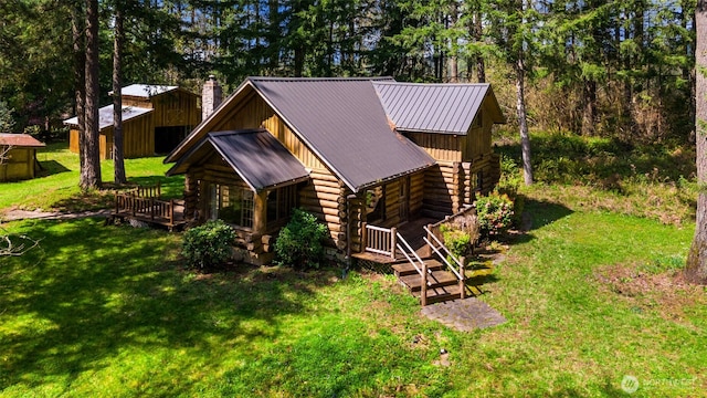 19708 NE 288th Cir, Battle Ground, WA 98604 - exterior space with a front yard, metal roof, log exterior, and a chimney