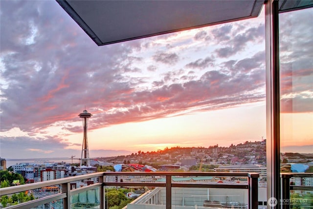 balcony at dusk with a city view