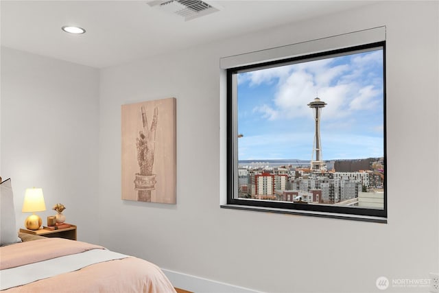 bedroom featuring baseboards, visible vents, and recessed lighting