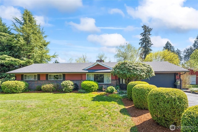 9811 NE 152nd Ave, Vancouver, WA 98682 - single story home with a front lawn, brick siding, driveway, and a garage
