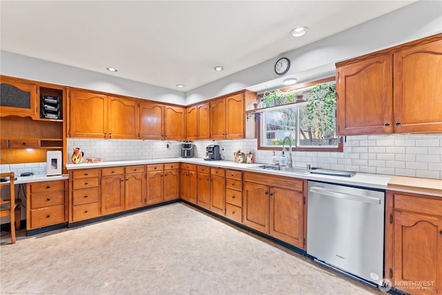 9811 NE 152nd Ave, Vancouver, WA 98682 - kitchen with tasteful backsplash, a sink, brown cabinets, dishwasher, and light countertops