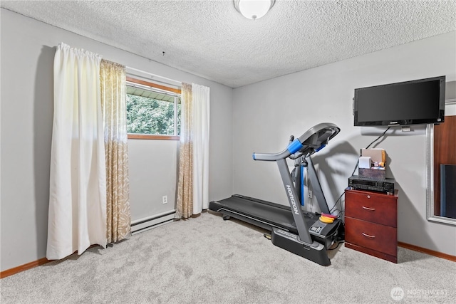 9811 NE 152nd Ave, Vancouver, WA 98682 - exercise room with baseboards, carpet flooring, and a textured ceiling