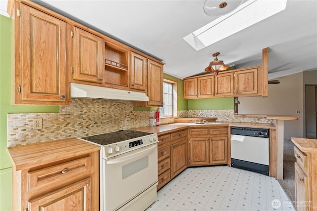9811 NE 152nd Ave, Vancouver, WA 98682 - kitchen featuring vaulted ceiling with skylight, decorative backsplash, white appliances, light floors, and under cabinet range hood