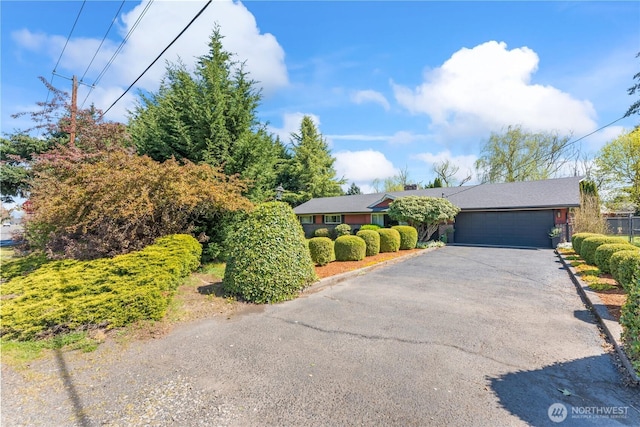 9811 NE 152nd Ave, Vancouver, WA 98682 - ranch-style house with driveway, fence, and a garage