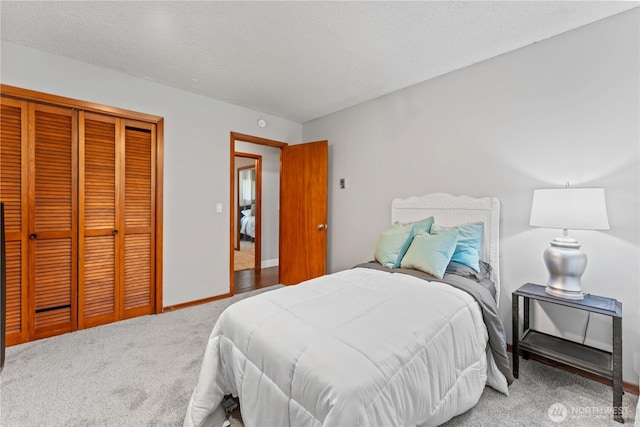 9811 NE 152nd Ave, Vancouver, WA 98682 - carpeted bedroom featuring a textured ceiling, a closet, and baseboards