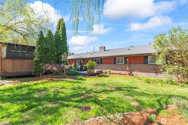9811 NE 152nd Ave, Vancouver, WA 98682 - back of house featuring a chimney, brick siding, and a yard