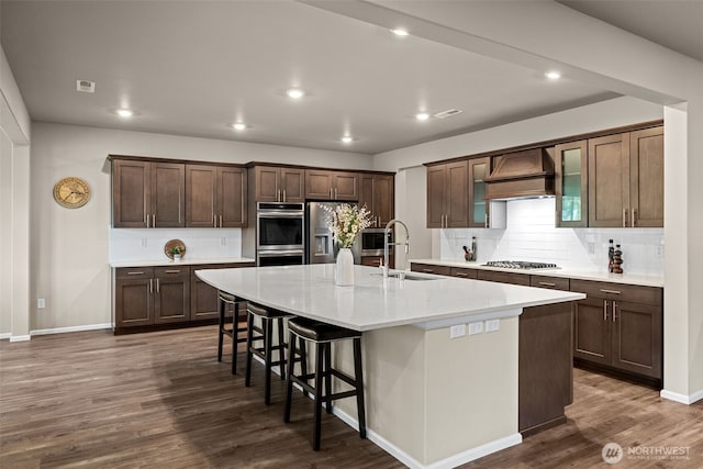 32832 SE Stevens St, Black Diamond, WA 98010 - kitchen with appliances with stainless steel finishes, a sink, a large island, tasteful backsplash, and custom exhaust hood