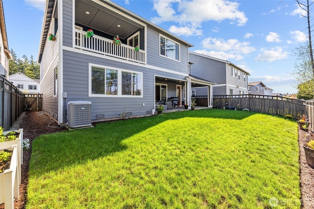 32832 SE Stevens St, Black Diamond, WA 98010 - back of house with a lawn, central AC unit, a fenced backyard, and a balcony