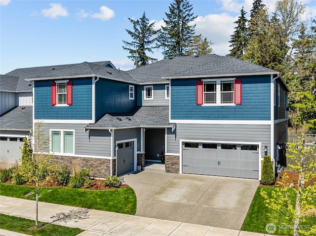 32832 SE Stevens St, Black Diamond, WA 98010 - view of front of house with concrete driveway, stone siding, and a garage