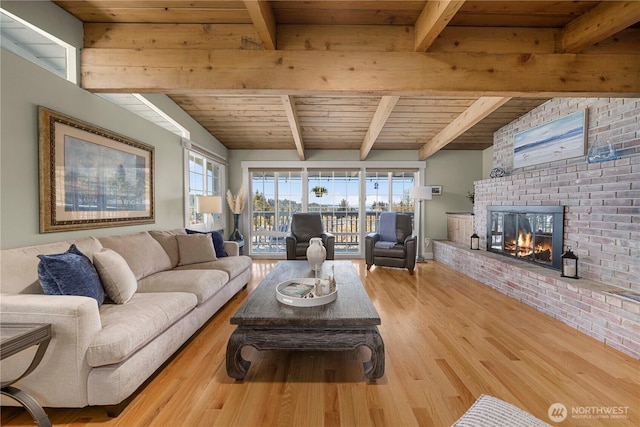 7501 Stinson Ave, Gig Harbor, WA 98335 - living area with wooden ceiling, wood finished floors, beam ceiling, and a fireplace
