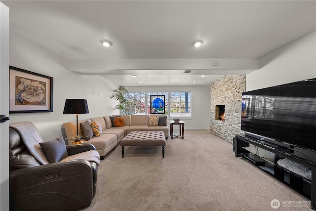 7501 Stinson Ave, Gig Harbor, WA 98335 - carpeted living area featuring a fireplace, visible vents, and recessed lighting