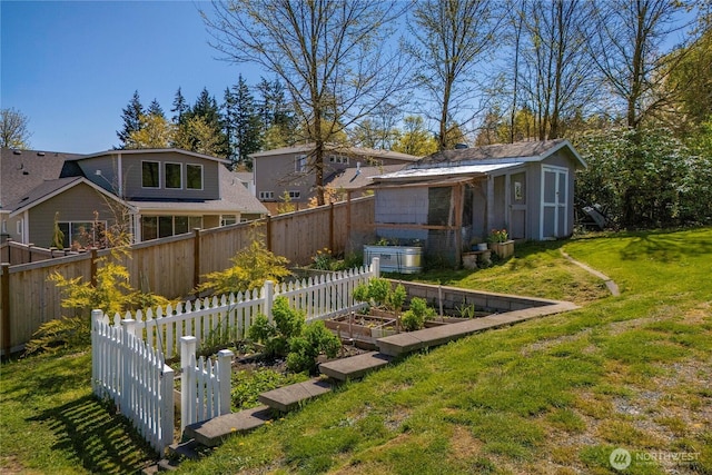 7501 Stinson Ave, Gig Harbor, WA 98335 - view of yard with an outdoor structure, a garden, fence, and a storage shed