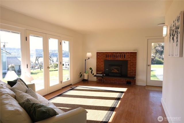 4182 Scatchet View Dr, Clinton, WA 98236 - living room with baseboards, a fireplace, and wood finished floors