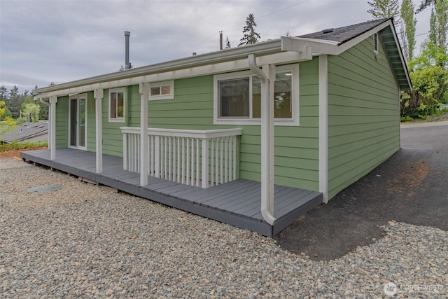rear view of property with a deck