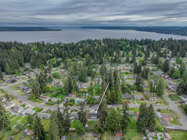 aerial view of property's location featuring a large body of water