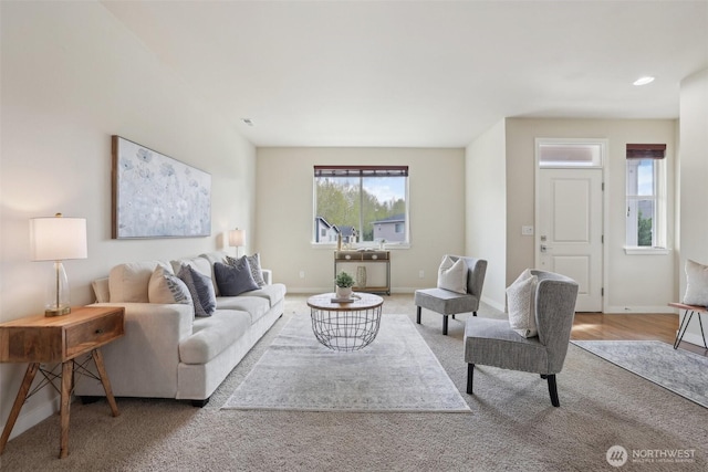 living room featuring recessed lighting, wood finished floors, and baseboards