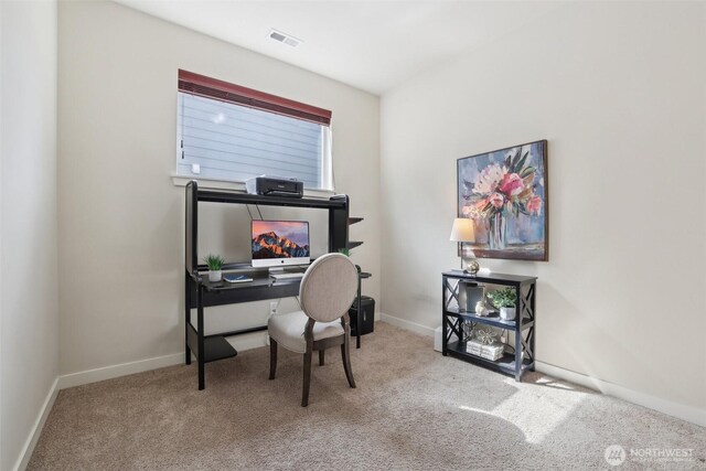 office area with baseboards, visible vents, and carpet