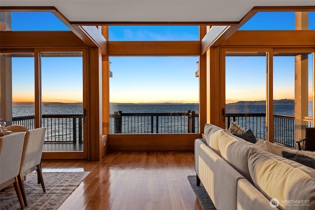 3103 Alki Ave SW, Seattle, WA 98116 - sunroom featuring a water view, wood finished floors, and plenty of natural light