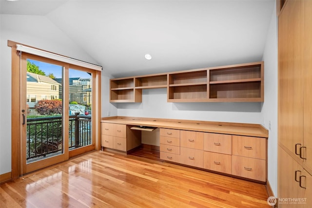 3103 Alki Ave SW, Seattle, WA 98116 - unfurnished office with built in desk, light wood finished floors, vaulted ceiling, and baseboards