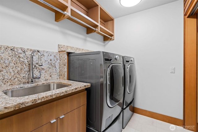 3103 Alki Ave SW, Seattle, WA 98116 - clothes washing area with washer and clothes dryer and cabinet space