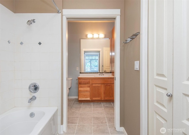 full bathroom with baseboards, shower / washtub combination, toilet, vanity, and tile patterned flooring