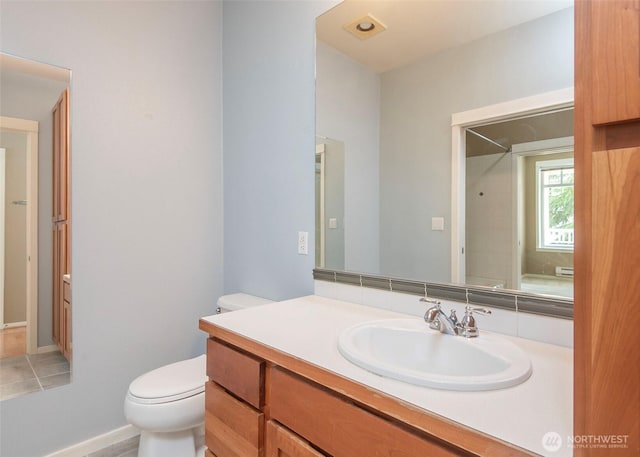full bathroom with toilet, vanity, and a shower