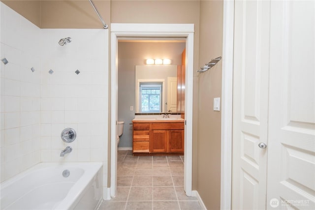 full bathroom with vanity, baseboards, tile patterned floors, toilet, and shower / bathing tub combination