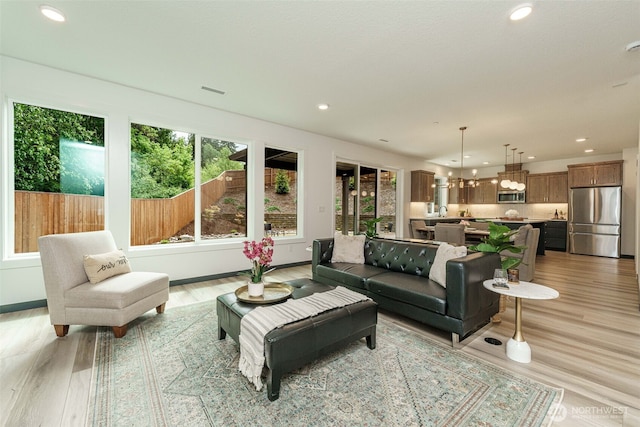 2302 S Royal Ct, Ridgefield, WA 98642 - living area with plenty of natural light, recessed lighting, light wood-style flooring, and a chandelier