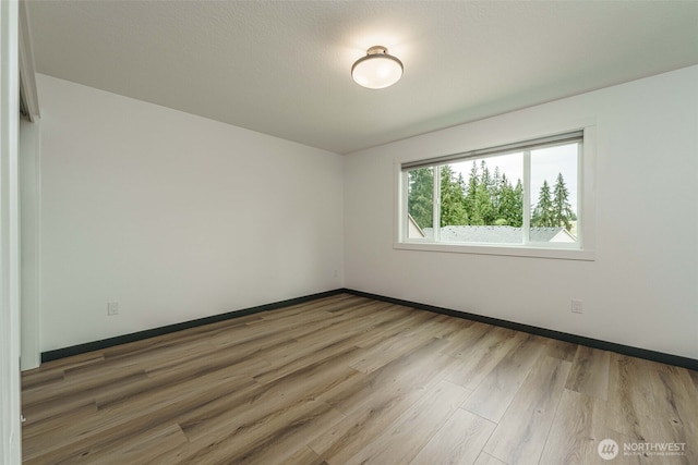 2302 S Royal Ct, Ridgefield, WA 98642 - spare room with wood finished floors and baseboards