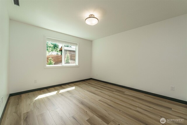 2302 S Royal Ct, Ridgefield, WA 98642 - empty room featuring wood finished floors and baseboards