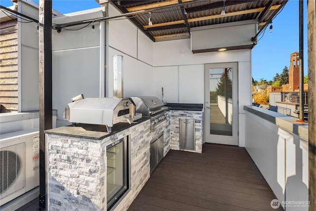 view of patio / terrace with an outdoor kitchen, ac unit, and area for grilling