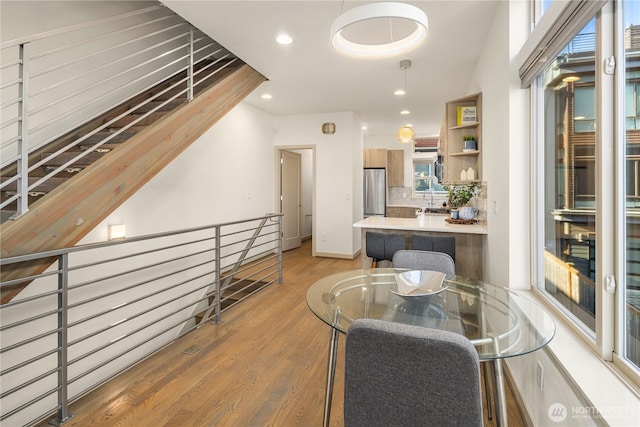 dining area featuring recessed lighting and light wood-type flooring