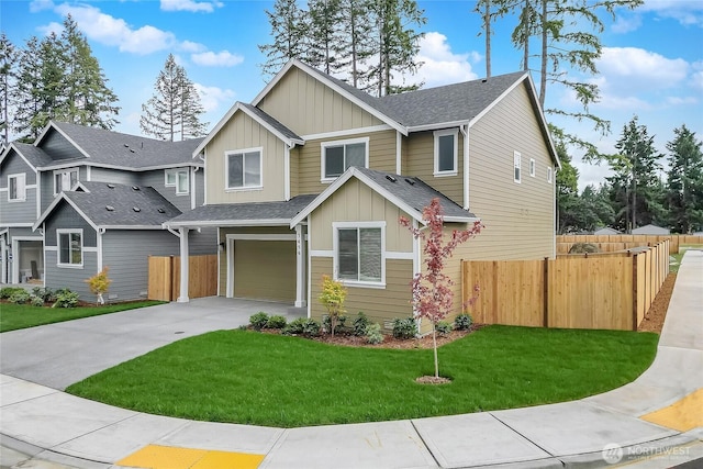 craftsman-style home featuring a garage, concrete driveway, board and batten siding, fence, and a front yard