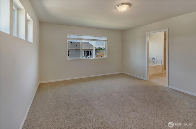 18213 35th Avenue Ct E, Tacoma, WA 98446 - carpeted spare room featuring baseboards