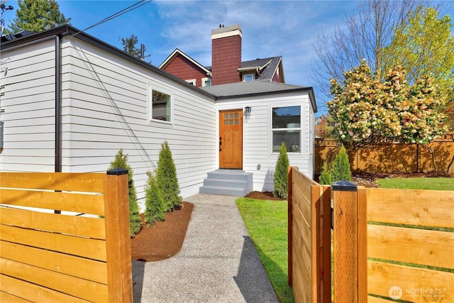 view of front of house featuring fence and entry steps
