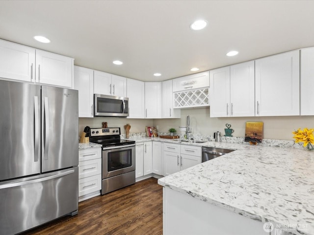 17581 110th Ln SE Unit 3, Renton, WA 98055 - kitchen featuring appliances with stainless steel finishes, a sink, white cabinets, and recessed lighting